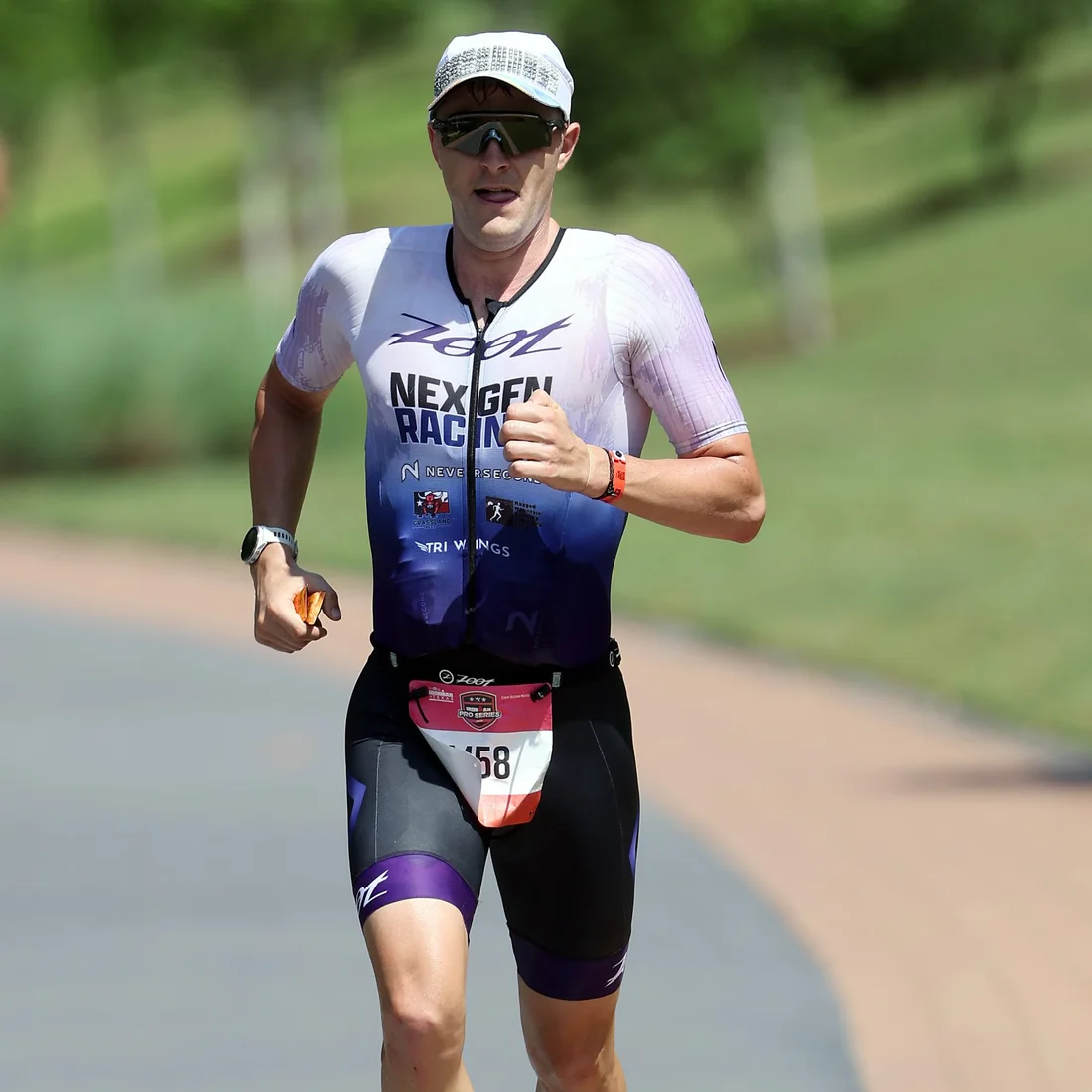 Elliot Bach running in a NexGen Racing race suit