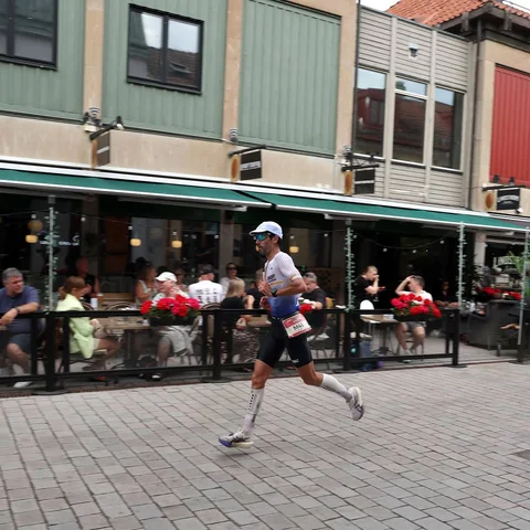 Filipe Azevedo running through the town at IRONMAN Sweden 2026